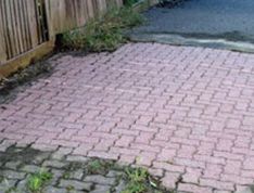 pressure washing moss and weed filled pathways